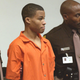 In this Oct. 22, 2003, photo, Lee Boyd Malvo (center) is escorted by deputies as he is brought into court in Virginia Beach, Va.